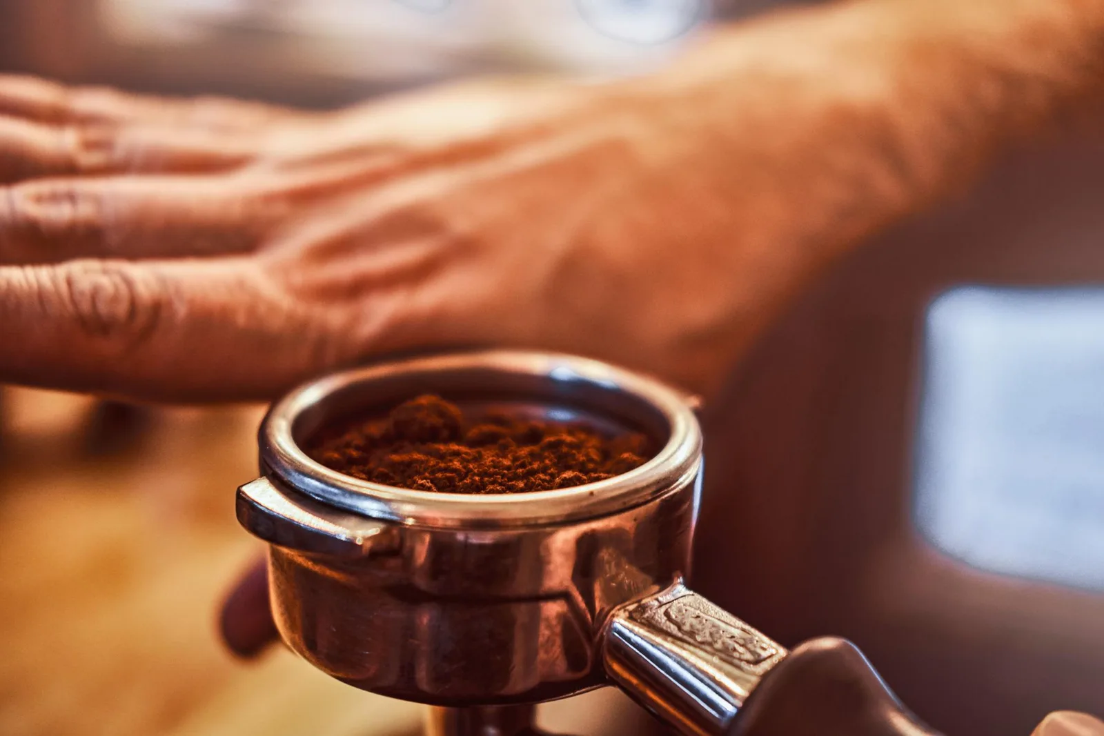 A portafilter filled with freshly ground coffee